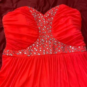 Formal Event Dress for Wedding or Prom it is a bright neon Reddish color